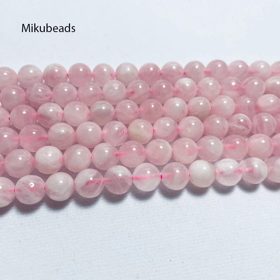 Търговия на едро Натурален 10 мм Мадагаскар розов кварц кристал гладка кръгла камък хлабав мъниста за вземане на бижута DIY огърлица Strand